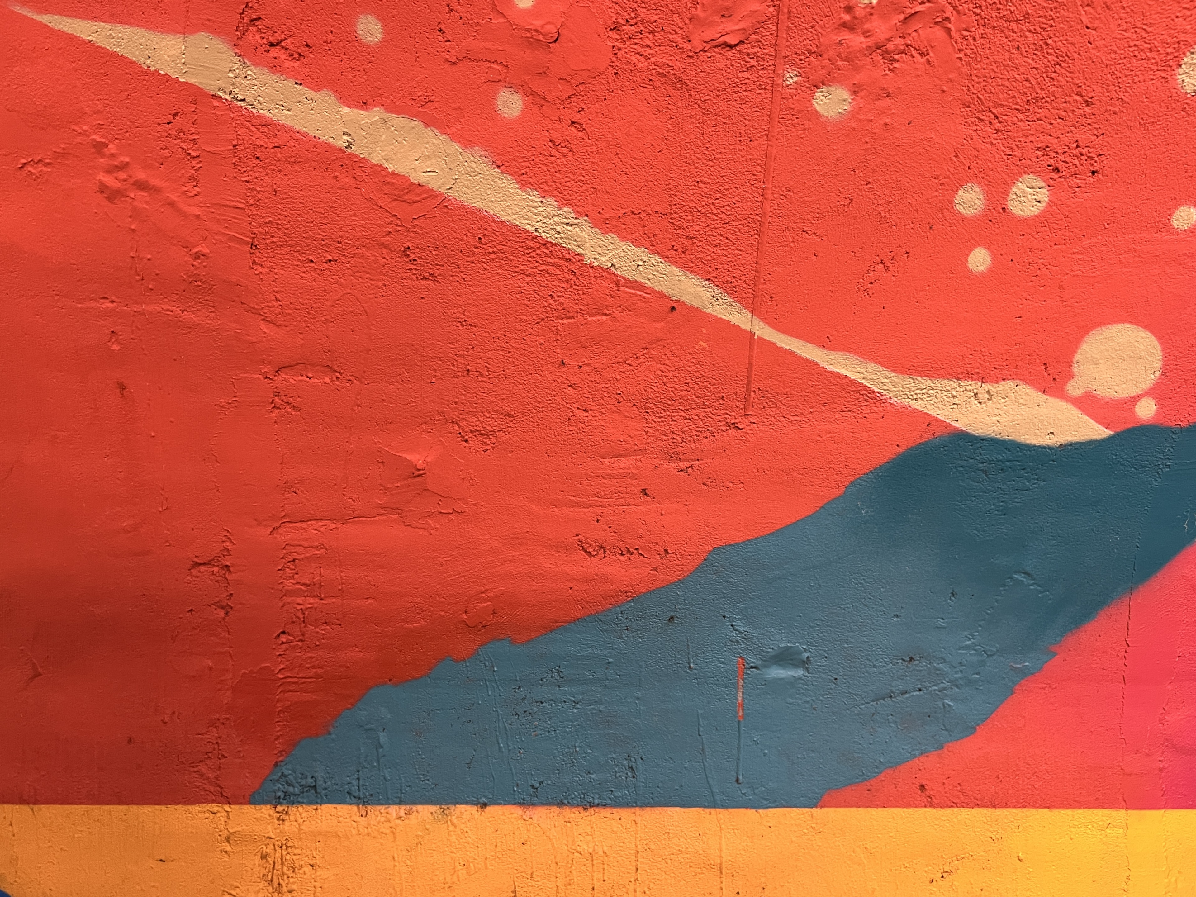 Pink graffiti on a Paris street wall